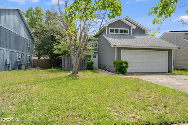 view of front of home with central AC unit, driveway, fence, a garage, and roof with shingles