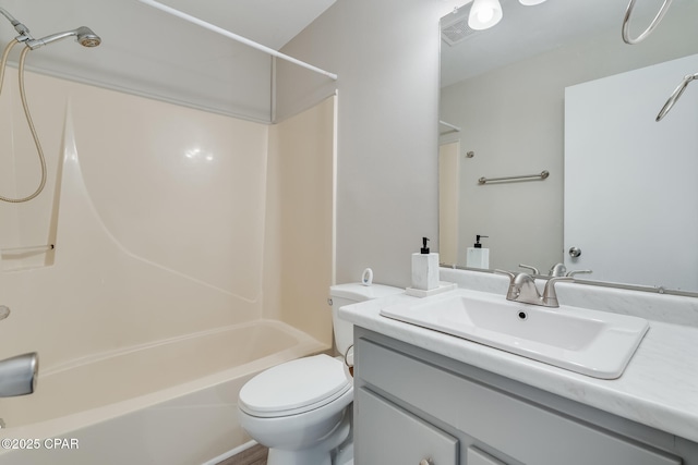 full bath with visible vents, toilet, vanity, and shower / washtub combination