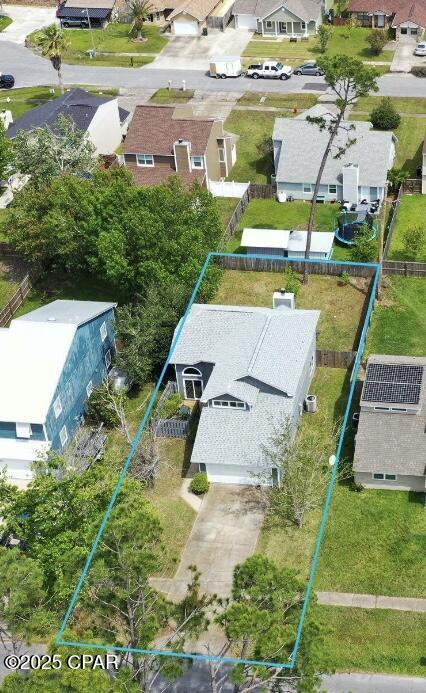 birds eye view of property with a residential view