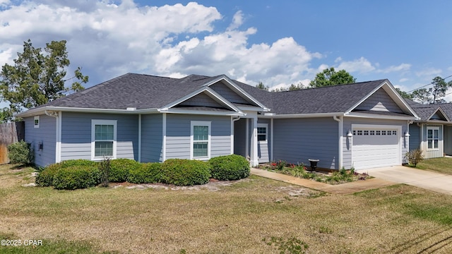 single story home featuring a garage, a shingled roof, a front yard, and concrete driveway