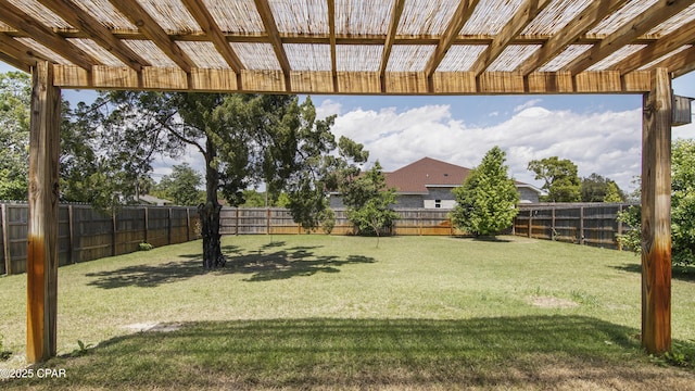view of yard with a fenced backyard and a pergola