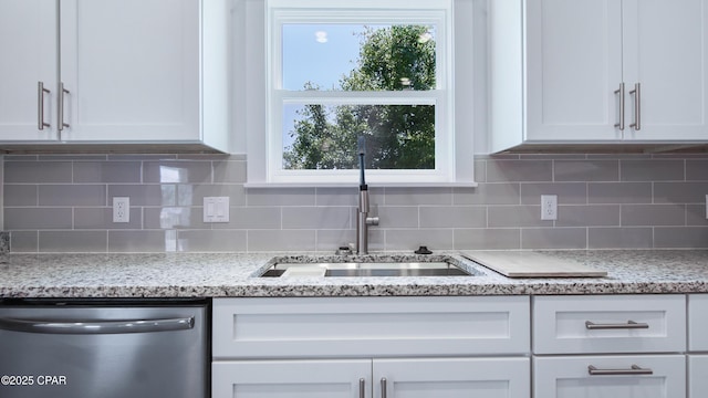 1113 New Hampshire Ave, Lynn Haven, FL 32444 - kitchen featuring white cabinets, backsplash, dishwasher, and a sink