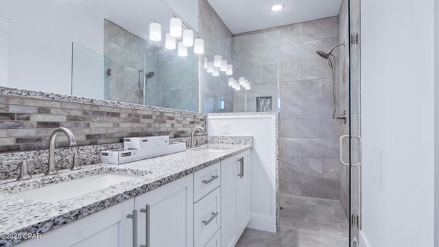 1113 New Hampshire Ave, Lynn Haven, FL 32444 - full bathroom featuring tiled shower, backsplash, double vanity, and a sink