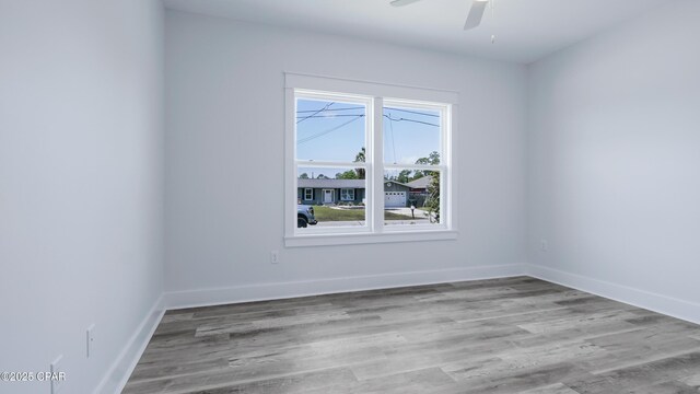 1113 New Hampshire Ave, Lynn Haven, FL 32444 - unfurnished room featuring wood finished floors, ceiling fan, and baseboards
