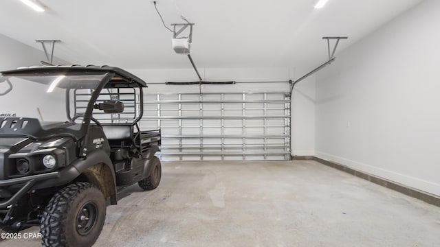1113 New Hampshire Ave, Lynn Haven, FL 32444 - garage featuring a garage door opener and baseboards