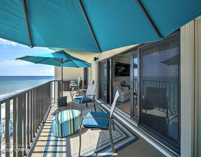 balcony featuring a water view