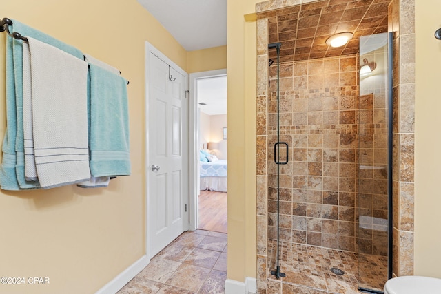 8730 Thomas Dr Unit 1311C, Panama City Beach, FL 32408 - full bathroom featuring a stall shower and ensuite bathroom