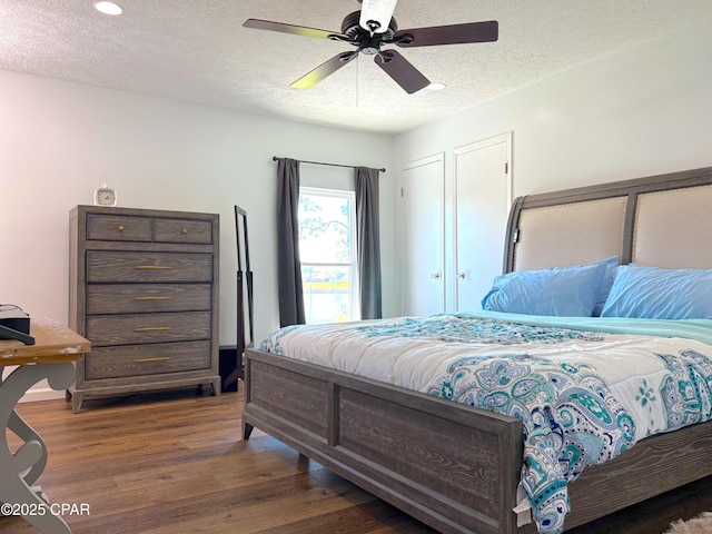 312 Sukoshi Dr, Panama City, FL 32404 - bedroom featuring recessed lighting, wood finished floors, a textured ceiling, and ceiling fan