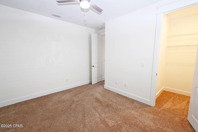 3116 Veranda Ave, Panama City, FL 32405 - unfurnished bedroom featuring a walk in closet, visible vents, baseboards, and light carpet