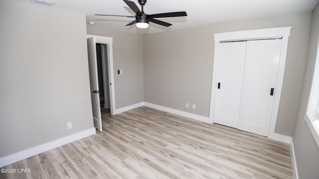 6401 Chipewa St, Panama City, FL 32404 - unfurnished bedroom with ceiling fan, a closet, visible vents, wood finished floors, and baseboards
