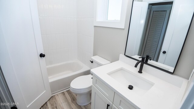 6401 Chipewa St, Panama City, FL 32404 - full bathroom with vanity, a closet, toilet, tub / shower combination, and wood finished floors