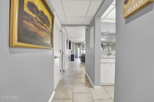 520 Richard Jackson Blvd Unit 2005, Panama City Beach, FL 32407 - hall featuring baseboards, a drop ceiling, and light tile patterned floors