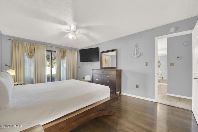 520 Richard Jackson Blvd Unit 2005, Panama City Beach, FL 32407 - bedroom with a ceiling fan, a textured ceiling, wood finished floors, baseboards, and ensuite bath