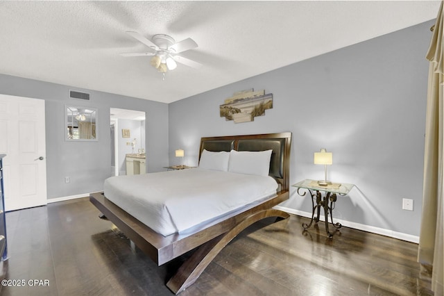 520 Richard Jackson Blvd Unit 2005, Panama City Beach, FL 32407 - bedroom featuring visible vents, wood finished floors, baseboards, ensuite bathroom, and a textured ceiling