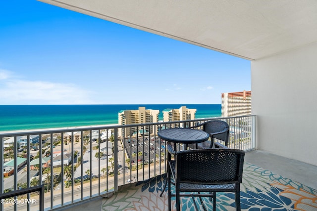 balcony with a view of the beach and a water view