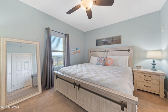 bedroom featuring a ceiling fan and light carpet