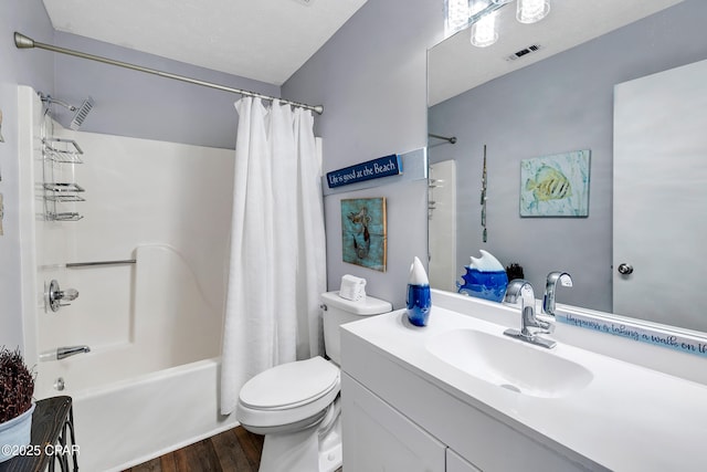 17462 Front Beach Rd Unit 33D, Panama City Beach, FL 32413 - bathroom featuring shower / bath combo, wood finished floors, vanity, toilet, and visible vents