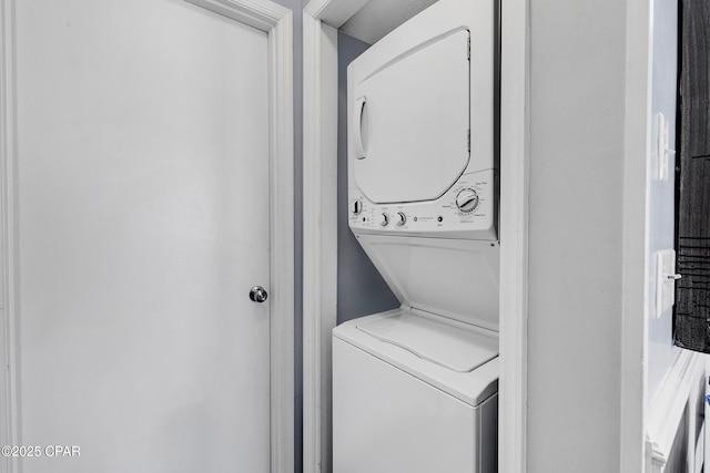 17462 Front Beach Rd Unit 33D, Panama City Beach, FL 32413 - clothes washing area featuring stacked washer / dryer