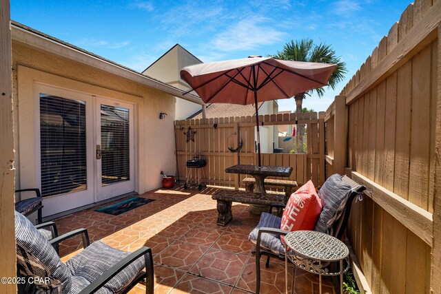 17462 Front Beach Rd Unit 33D, Panama City Beach, FL 32413 - view of patio with fence and french doors