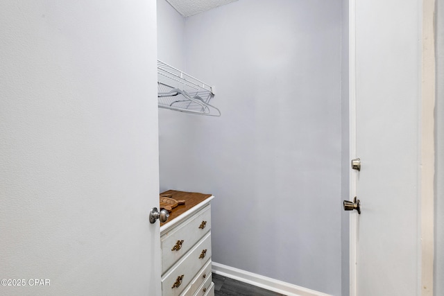17462 Front Beach Rd Unit 33D, Panama City Beach, FL 32413 - walk in closet with dark wood-type flooring
