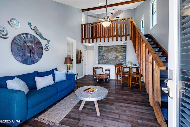 17462 Front Beach Rd Unit 33D, Panama City Beach, FL 32413 - living area featuring stairway, wood finished floors, ceiling fan, a towering ceiling, and beamed ceiling
