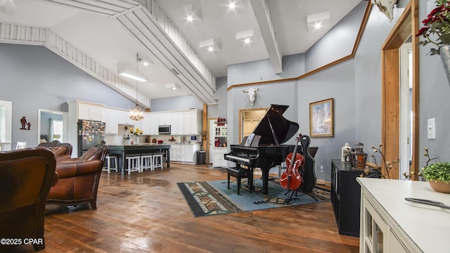 living room featuring high vaulted ceiling and dark wood-style floors