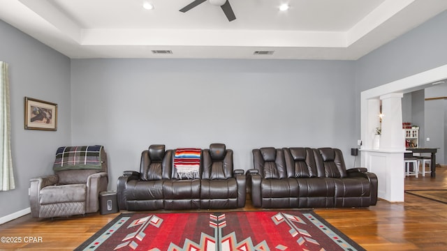 10583 State Road 20, Clarksville, FL 32430 - living area with a ceiling fan, decorative columns, wood finished floors, and a raised ceiling
