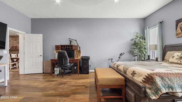 bedroom featuring wood finished floors