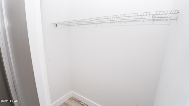walk in closet featuring light wood-type flooring