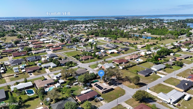 bird's eye view with a residential view and a water view