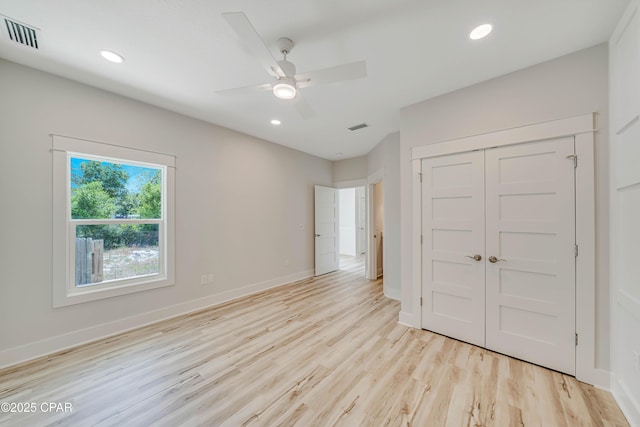 309 Paridiso Pl Unit A, Panama City Beach, FL 32413 - unfurnished bedroom featuring light wood finished floors, baseboards, recessed lighting, and a closet