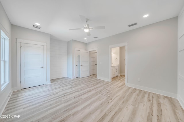 309 Paridiso Pl Unit A, Panama City Beach, FL 32413 - unfurnished bedroom with light wood finished floors, baseboards, recessed lighting, ensuite bath, and ceiling fan