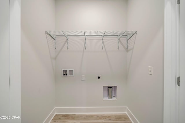 309 Paridiso Pl Unit A, Panama City Beach, FL 32413 - washroom with hookup for an electric dryer, baseboards, light wood-type flooring, and washer hookup