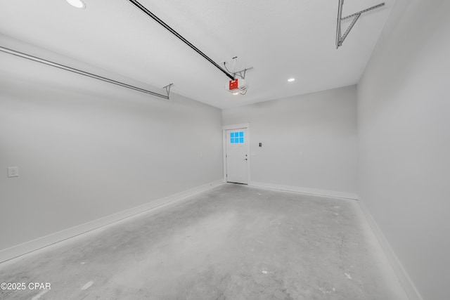 309 Paridiso Pl Unit A, Panama City Beach, FL 32413 - garage with recessed lighting, baseboards, and a garage door opener