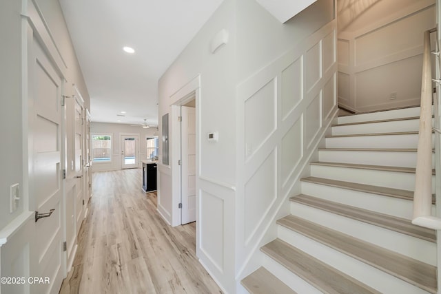 309 Paridiso Pl Unit A, Panama City Beach, FL 32413 - staircase featuring wood finished floors and recessed lighting