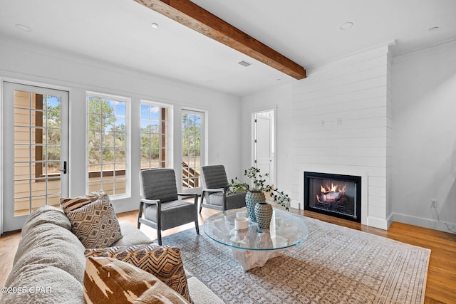 1502 Match Point Ln Unit 402, Panama City Beach, FL 32413 - living room featuring light wood-style floors, a fireplace, beam ceiling, crown molding, and recessed lighting