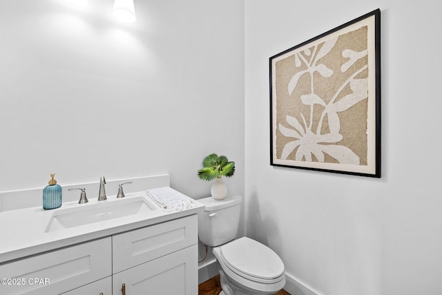 1502 Match Point Ln Unit 402, Panama City Beach, FL 32413 - half bathroom featuring toilet and vanity