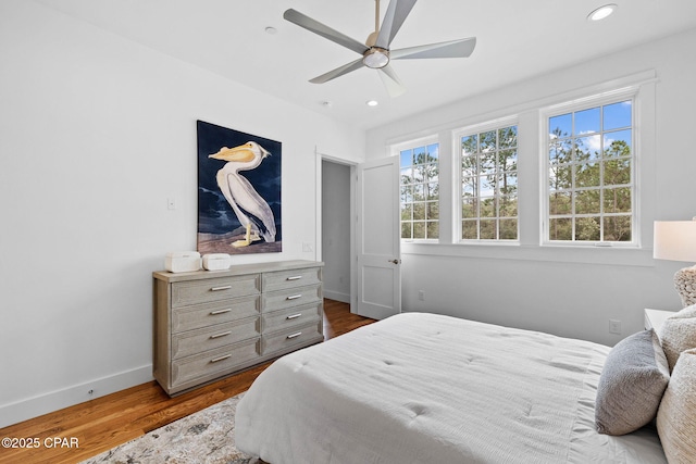 1502 Match Point Ln Unit 402, Panama City Beach, FL 32413 - bedroom with dark wood-style flooring, recessed lighting, and a ceiling fan