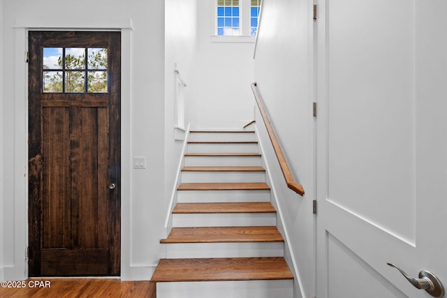 1502 Match Point Ln Unit 402, Panama City Beach, FL 32413 - stairs featuring healthy amount of natural light and wood finished floors