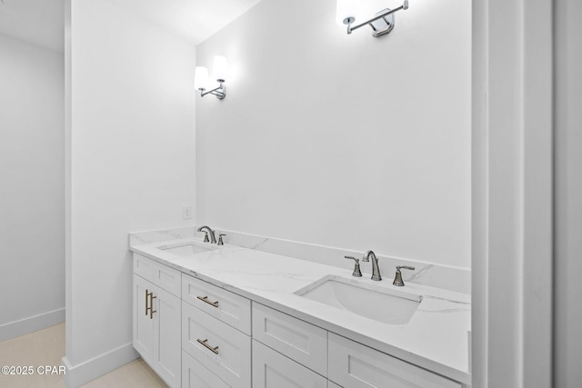 1502 Match Point Ln Unit 402, Panama City Beach, FL 32413 - bathroom with double vanity and baseboards