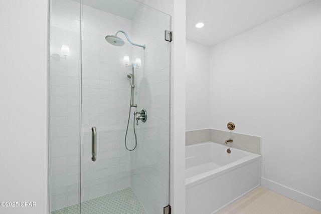 1502 Match Point Ln Unit 402, Panama City Beach, FL 32413 - bathroom featuring a shower stall, a bath, and recessed lighting