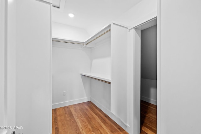 1502 Match Point Ln Unit 402, Panama City Beach, FL 32413 - walk in closet with light wood-style flooring