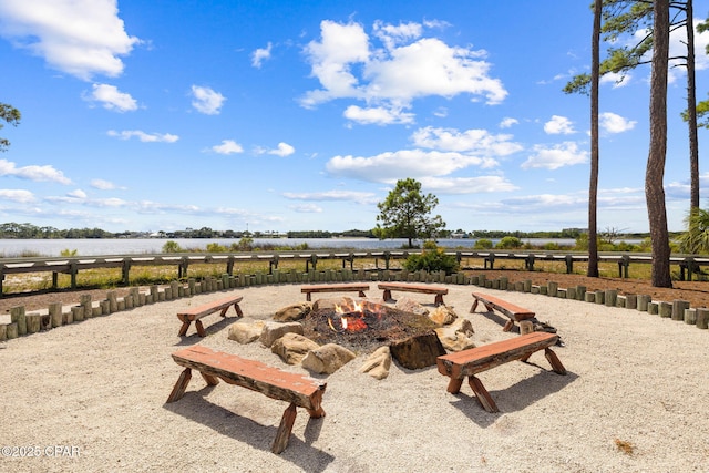1502 Match Point Ln Unit 402, Panama City Beach, FL 32413 - view of patio / terrace featuring a fire pit and a water view