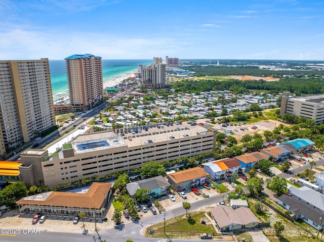 drone / aerial view featuring a water view and a city view