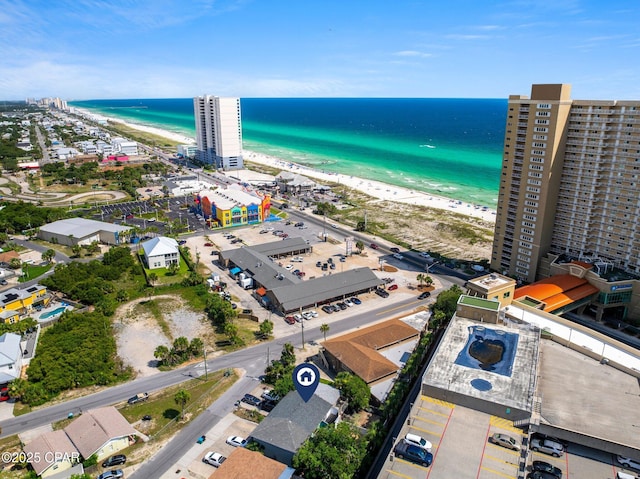 bird's eye view featuring a water view and a view of the beach