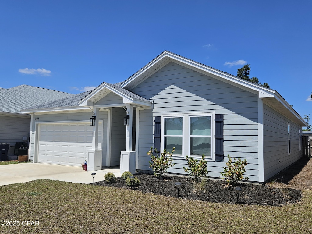 view of front of home featuring driveway and an attached garage