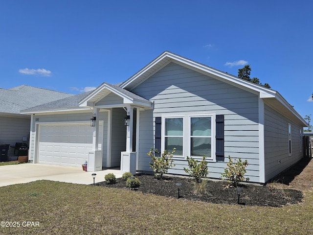 view of front of home featuring driveway and an attached garage