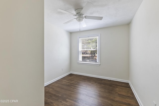 empty room with baseboards, a ceiling fan, and wood finished floors