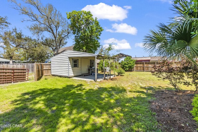 view of yard with a fenced backyard and a patio