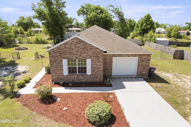 view of front of property featuring brick siding, an attached garage, driveway, and a front lawn